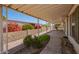 The patio is covered and has beautiful plants lining its perimeter at 16215 N 35Th Way, Phoenix, AZ 85032