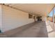 This covered patio features white paneling and concrete flooring at 16215 N 35Th Way, Phoenix, AZ 85032