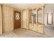 View of the entryway, wood paneled walls and built-in display case at 16215 N 35Th Way, Phoenix, AZ 85032