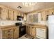 Kitchen featuring wood cabinets, black appliances, wood countertops and an adjoining living area at 16215 N 35Th Way, Phoenix, AZ 85032