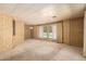 Spacious living room featuring carpet floors and ample natural light at 16215 N 35Th Way, Phoenix, AZ 85032