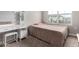 Bright bedroom with natural light, makeup vanity, and cozy decor at 16539 W Winston Dr, Goodyear, AZ 85338
