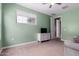 Neutral carpet, simple dresser, and natural light in this comfortable bedroom at 16539 W Winston Dr, Goodyear, AZ 85338