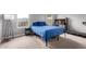 Bedroom featuring natural light, a desk, and a treadmill at 16539 W Winston Dr, Goodyear, AZ 85338