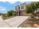 Stunning two-story home with a large driveway and well-manicured desert landscaping at 16539 W Winston Dr, Goodyear, AZ 85338
