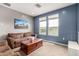 Inviting living room features plush furniture and a bright view from the windows at 16539 W Winston Dr, Goodyear, AZ 85338