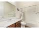 Well-lit bathroom featuring a shower over tub and sleek vanity at 17506 W Hadley St, Goodyear, AZ 85338
