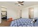 Well-lit bedroom with spacious walk-in closet and ceiling fan at 17506 W Hadley St, Goodyear, AZ 85338