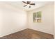 Bedroom featuring modern ceiling fan and stylish tile flooring at 17506 W Hadley St, Goodyear, AZ 85338