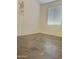 Neutral bedroom with durable flooring, plenty of natural light, and modern wall decor at 17506 W Hadley St, Goodyear, AZ 85338