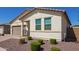 Attractive single-story home with a brown garage door, desert-friendly landscaping, and well-kept yard at 17506 W Hadley St, Goodyear, AZ 85338