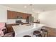 Modern kitchen features stainless appliances, center island with countertop, and seamless cabinets at 17506 W Hadley St, Goodyear, AZ 85338