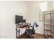 Cozy home office setup with desk, computer, and natural light at 17506 W Hadley St, Goodyear, AZ 85338