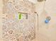 Shower featuring decorative tile and niche for storage at 17506 W Hadley St, Goodyear, AZ 85338