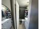 Well-organized bathroom with white vanity, large mirror, and tiled shower at 2007 N 55Th Ln, Phoenix, AZ 85035