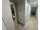 Hallway with storage and access to bathroom and another room at 2007 N 55Th Ln, Phoenix, AZ 85035