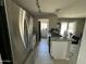 Modern kitchen featuring stainless steel appliances, a granite countertop, and bright lighting for cooking at 2007 N 55Th Ln, Phoenix, AZ 85035