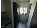 Laundry area features stacked washer/dryer and a bright window, making chores a little more enjoyable at 2007 N 55Th Ln, Phoenix, AZ 85035
