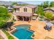 An aerial view of the backyard with a pool, patio, and outdoor seating, perfect for entertaining at 20639 W Grandview Dr, Buckeye, AZ 85396
