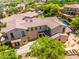 Beautifully landscaped property with a sprawling lawn, mature trees, and a circular driveway at 20639 W Grandview Dr, Buckeye, AZ 85396