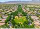 Neighborhood aerial showcasing well-maintained homes with tree-lined streets at 20639 W Grandview Dr, Buckeye, AZ 85396