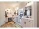 Spacious Primary bathroom boasting dual vanities, wood floors, and a walk-in closet at 20639 W Grandview Dr, Buckeye, AZ 85396