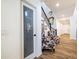 Welcoming foyer with hardwood floors, staircase, and decorative seating area at 20639 W Grandview Dr, Buckeye, AZ 85396