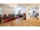 Inviting living room with hardwood floors, modern chandelier, and stylish furnishings at 20639 W Grandview Dr, Buckeye, AZ 85396