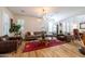 Spacious living room with hardwood floors, modern lighting, and comfortable seating at 20639 W Grandview Dr, Buckeye, AZ 85396