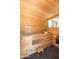 Wood sauna with multi-tiered bench seating, and exterior window for a spa like retreat in your own backyard at 20639 W Grandview Dr, Buckeye, AZ 85396