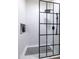 A frameless walk-in shower featuring black hardware, unique patterned tile, and a built-in niche for toiletries at 20639 W Grandview Dr, Buckeye, AZ 85396