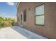 Second story balcony with access door, multiple windows and neutral stucco siding at 2114 E Escuda Rd, Phoenix, AZ 85024