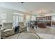 Open kitchen with stainless appliances, an island with barstool seating, and a dining area at 2114 E Escuda Rd, Phoenix, AZ 85024