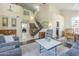 Spacious living room with high ceilings, a staircase, and plenty of natural light at 2114 E Escuda Rd, Phoenix, AZ 85024