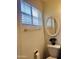 Bathroom features modern fixtures, classic mirror and neutral color palette at 2115 W Myrtle Ave, Phoenix, AZ 85021