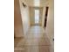 Inviting entryway with tile flooring and a glass-paneled door welcomes you into this charming home at 2115 W Myrtle Ave, Phoenix, AZ 85021