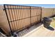 The backyard's metal and wood gate provides secure backyard access at 2115 W Myrtle Ave, Phoenix, AZ 85021