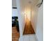 Hallway with wood floors leading to other rooms, showcasing the home's seamless flow at 2115 W Myrtle Ave, Phoenix, AZ 85021