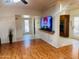 Open living room with wood floors, and easy access to other areas of the house at 2115 W Myrtle Ave, Phoenix, AZ 85021