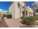 Exterior of a home featuring low maintenance desert landscaping, a small balcony, and stucco siding at 2134 W Peninsula Cir, Chandler, AZ 85248