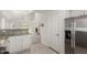 Bright kitchen featuring granite countertops, white cabinetry, and stainless steel appliances at 2134 W Peninsula Cir, Chandler, AZ 85248