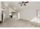 Open-concept living room featuring neutral carpeting, and ample natural light at 2134 W Peninsula Cir, Chandler, AZ 85248