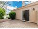 Paver patio provides a private outdoor space with easy access to the home's interior, next to lush landscaping at 2134 W Peninsula Cir, Chandler, AZ 85248