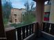 View from the balcony, featuring a pleasant community setting with mature trees and well-maintained landscaping at 2150 W Alameda Rd # 1109, Phoenix, AZ 85085