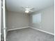 Clean, carpeted bedroom features neutral walls, a ceiling fan, and a bright window for a calming atmosphere at 2150 W Alameda Rd # 1109, Phoenix, AZ 85085
