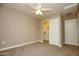 Comfortable bedroom with neutral walls, featuring a ceiling fan, a closet, and carpeted floors at 2150 W Alameda Rd # 1109, Phoenix, AZ 85085