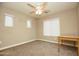 Neutral bedroom featuring a ceiling fan, carpet, and a window providing natural light at 2150 W Alameda Rd # 1109, Phoenix, AZ 85085