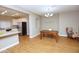 Open-concept dining area that flows into the modern kitchen and living room at 2150 W Alameda Rd # 1109, Phoenix, AZ 85085
