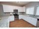 Beautiful kitchen with stainless steel appliances, granite countertops, and wood flooring at 2150 W Alameda Rd # 1109, Phoenix, AZ 85085