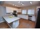 Well-lit kitchen features modern appliances, granite countertops, and ample cabinet space at 2150 W Alameda Rd # 1109, Phoenix, AZ 85085
